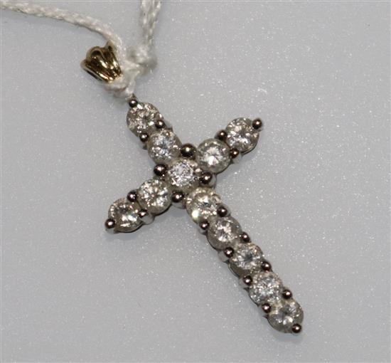 A 9ct gold and diamond set cross pendant, 1in inc. bale.